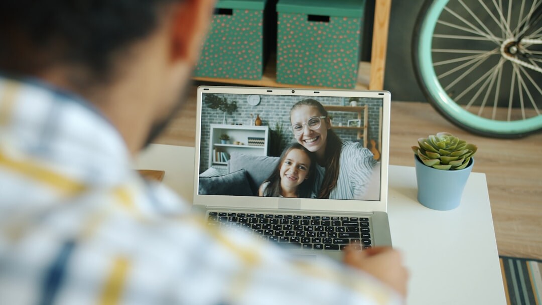 Business professionals in a video call on a laptop