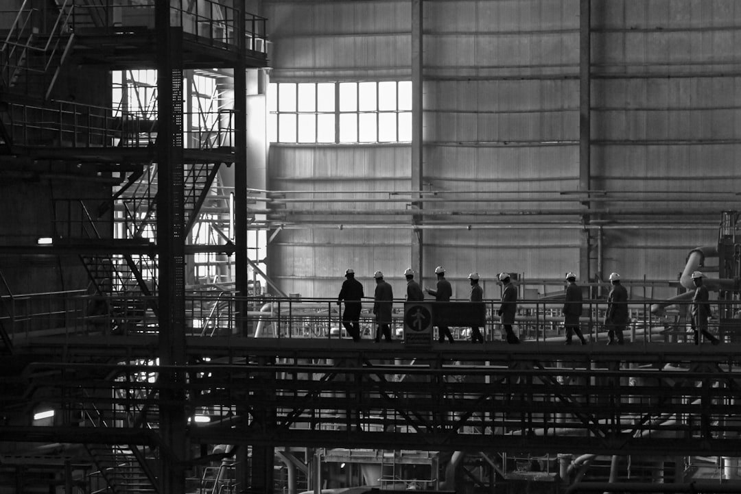 Industrial engineers meeting on a factory floor