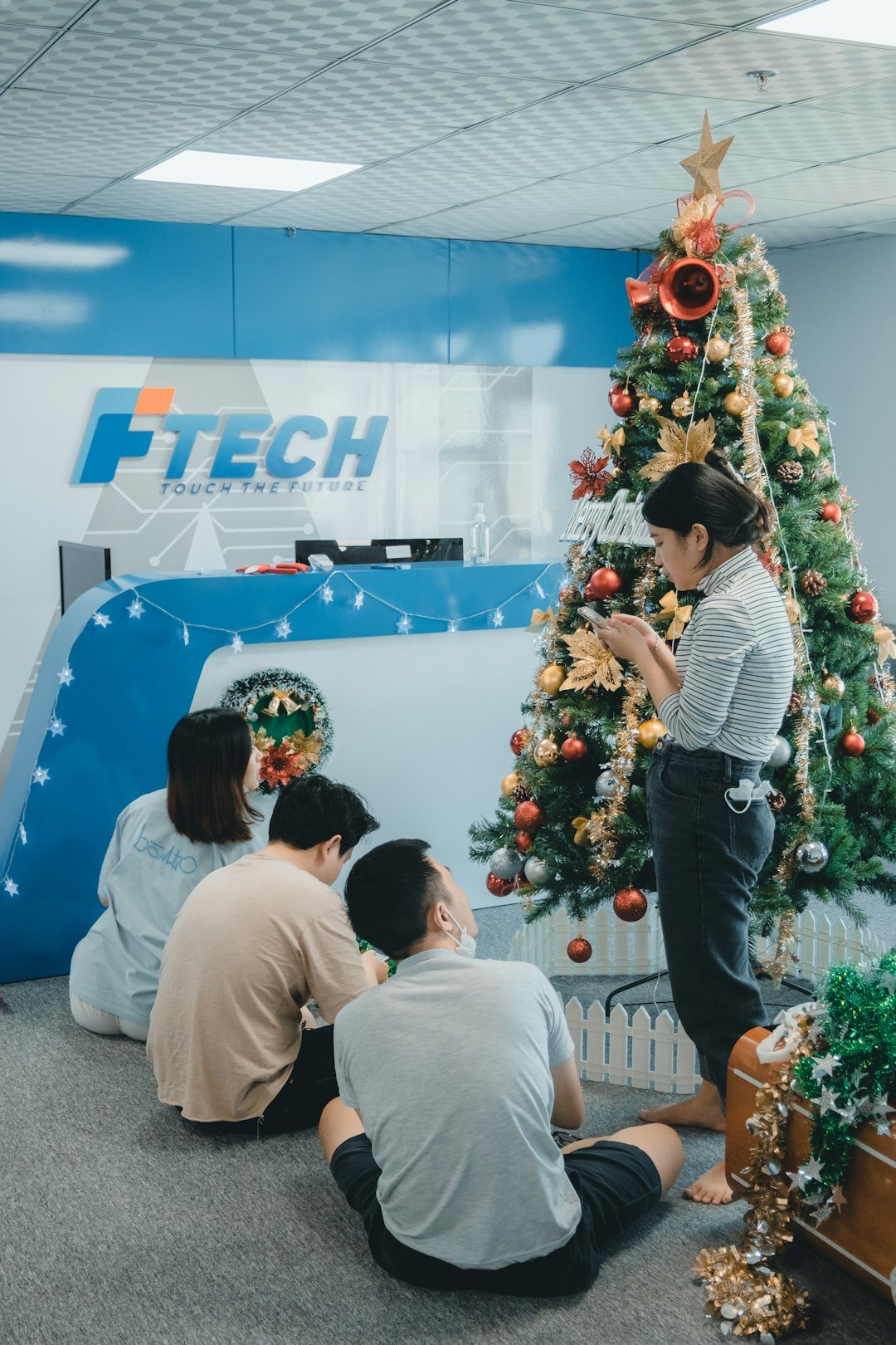 Tech professionals networking around a laptop